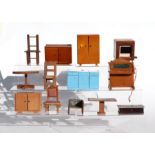 A quantity of doll's house furniture and accessories to include a wooden bureau, wardrobe,