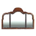 A 19th century walnut shaped rectangular overmantle mirror with bevel edged plate, 107cms wide.