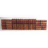 Twenty two leather bound books to include works by Thackery (22).