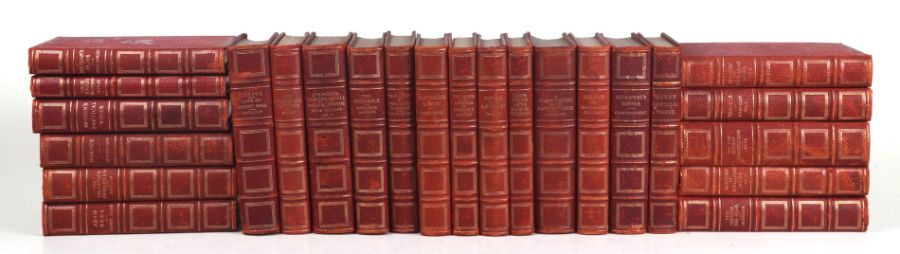 A run of fifty two red leather bound gentleman's library books with gilt tooled spines and gilt