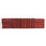 A run of fifty two red leather bound gentleman's library books with gilt tooled spines and gilt