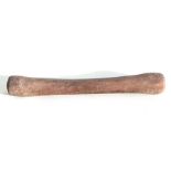 An African tribal art (possibly Neolithic) double-ended stone pounder, 45cms long.