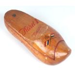 A Dutch cigar box in the form of a wooden clog with painted decoration, 28cms long.