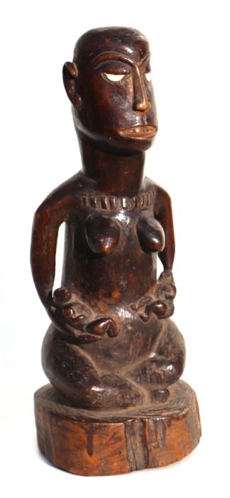 An African tribal art Bakongo funerary figure in the form of a female body with male head, 36cms