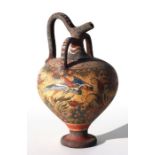 A Grecian terracotta ewer of traditional form with painted decoration depicting an aquatic scene,