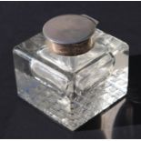 An Edwardian silver capped cut glass inkwell of substantial proportions, Birmingham 1907, initialled