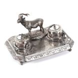 An Edwardian silver plated pen & ink stand with two inkwells, surmounted with a model of a stag,