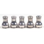 Five sterling silver pepper pots, each 4cms high, 43g.