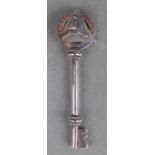 A Masonic white metal presentation key presented to 'JAV Rowe' and dated 1942, 11.5cms long.