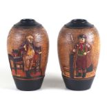A pair of Bretby Pottery vases decorated with Dickens characters, 19cms high.