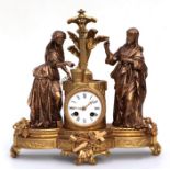 A French gilt spelter figural mantle clock, the white dial with Roman numerals, fitted with an 8-day