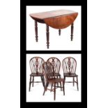 A set of four wheelback stained beech and elm dining chairs with solid seats and ring turned legs