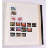 Four albums containing assorted World stamps to include Singapore, South Africa, Jamaica,