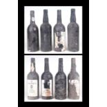 Eight bottles of Warre's 1963 vintage port, some with and some without paper labels, in an