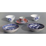 A Chinese tea bowl and saucer decorated with a dragon chasing a flaming pearl, four character mark