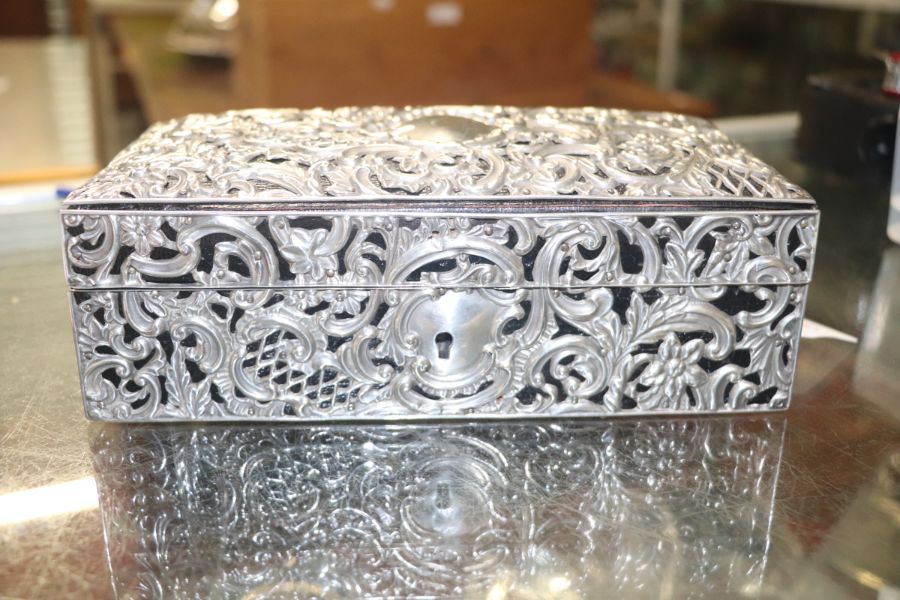 A Victorian leather jewellery box clad with silver repousse decoration, Chester 1896, 21cms wide. - Image 7 of 9
