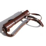 A vintage two draw field telescope complete with its original stitched leather covering and linked