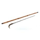 A bamboo shafted sword stick with a 51cms (20ins) square section blade and a horn handle. Makers