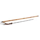 A cane shafted sword stick with a 48cms (19ins) square section blade and a stag horn handle.