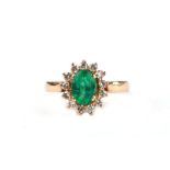 A 14ct gold emerald and diamond halo ring, approx UK size 'P', 4.7g.Condition ReportShank is ok, not