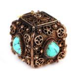 A Chinese silver gilt and turquoise set cube shaped pendant.