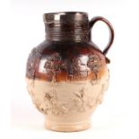 A large 19th century stoneware jug with white metal mounted rim, decorated with a hunt scene,