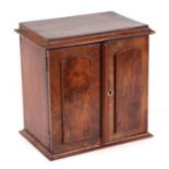 A Victorian figured walnut collector's chest, the pair of doors opening to reveal three drawers,