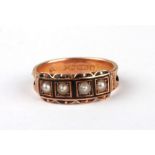 A Victorian 15ct gold and black enamel mourning ring set with four seed pearls, 9g.Condition