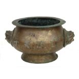 A Chinese bronze censer with twin mask handles, the box engraved with four characters, 20cms