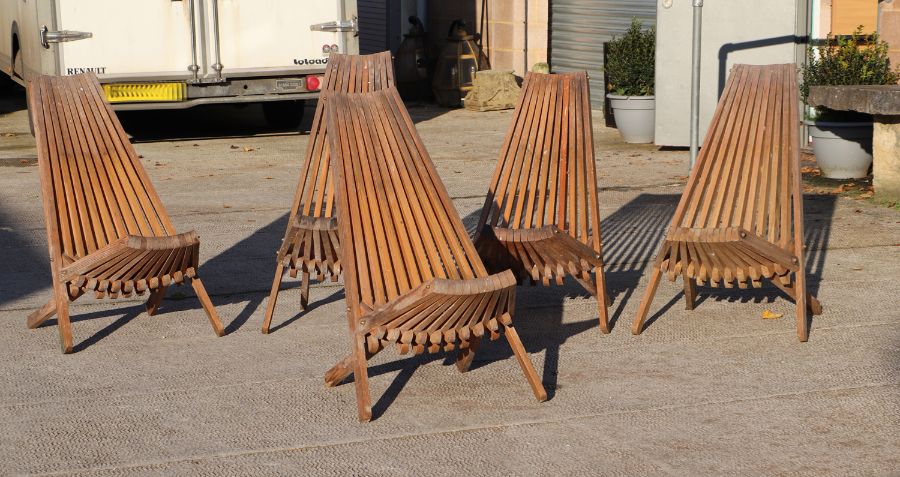 A set of five pine folding chairs.