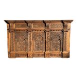A large carved oak panel incorporating 17th century elements to create an impressive three-