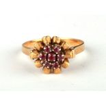 An 18ct gold ruby cluster ring, approx UK size 'O', 5.1g.Condition ReportShank ok, not thin