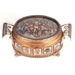 A late 19th / early 20th century gilt metal two-handled French dressing table box decorated with