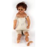 A late Victorian Lucy Peck wax head limb doll, the cloth stuffed body stamped 'From Mrs Peck the