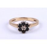 A 9ct gold sapphire and diamond cluster ring, approx UK size 'N', 2.4g.