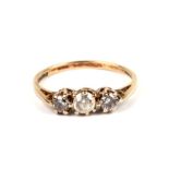 A 9ct gold ring set with three white stones, approx UK size 'K', 1.3g.