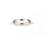 A white gold ring set with six diamonds, approx UK size 'K', 4.6g.