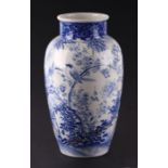 A Japanese Arita blue & white baluster vase decorated with birds and bamboo, 30cms high (a/f).