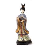 An early 20th century Chinese cloisonne figure of a robed woman with simulated ivory face and hands,