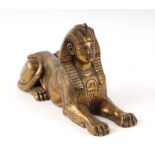 A Victorian Egyptian Revival Grand Tour bronze figure of a Sphinx, 26cms long.