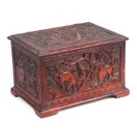 A Chinese carved wooden single compartment tea caddy, the panels carved depicting scenes of birds,