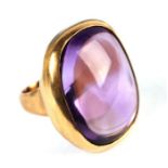 A French 18ct gold and large cabochon amethyst ring, the single stone measures approx 30 by 23 by