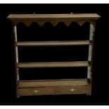 A set of 18th century style oak wall shelves with two plate racks above two short drawers, 103cms