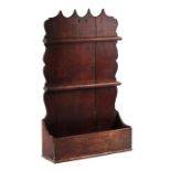 An 18th / 19th century oak two-tier spoon rack, 38cms wide.