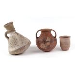 Antiquities. A group of pottery vessels to include a two-handled vase, largest 16cms high (3).