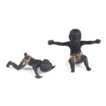 Two antique Vienna cold painted bronze miniatures depicting a seated black boy and a crawling