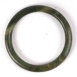 A jade / hardstone bangle, 8cms diameter.