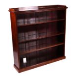 A Victorian mahogany open bookcase, the three-quarter gallery top above three adjustable shelves, on
