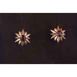 A pair of 9ct gold and garnet stud earrings.