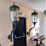 An impressive pair of Victorian country house brass and cast iron octagonal form wall lanterns, each